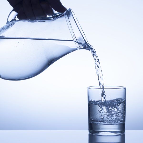 water splash from a pitcher into a glass